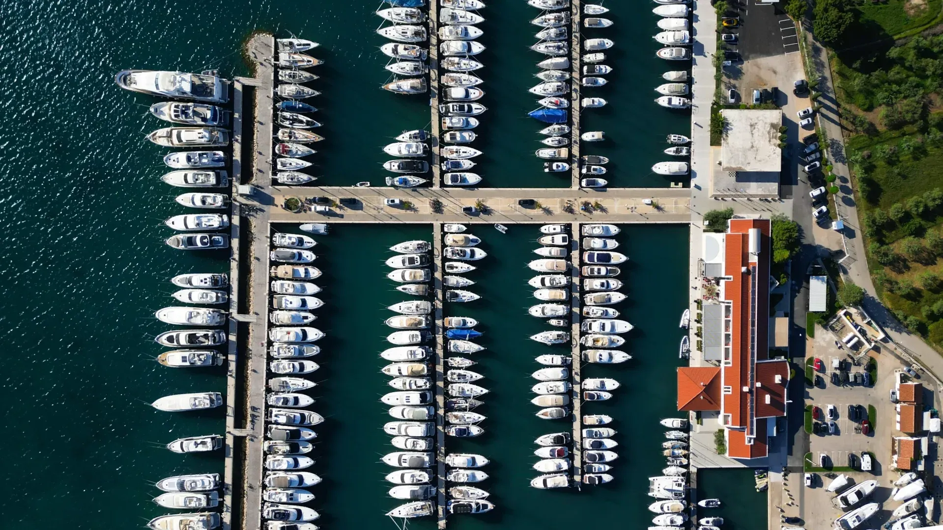 Yachts berthed at Marina Hramina with pontoons and calm harbour basin